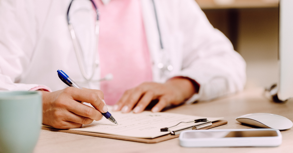 Provider writing on a clipboard, reflecting personalized care and expanded take-home methadone options in opioid recovery programs.