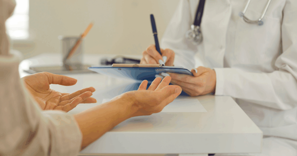 Doctor and patient discussing naltrexone treatment during medical consultation at clinic.
