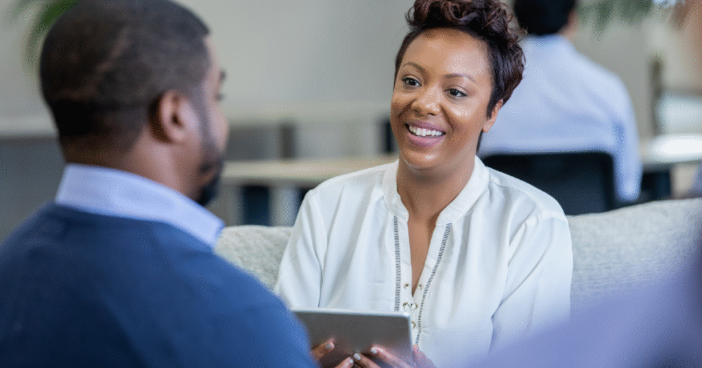 A social worker meeting with a patient, offering support and resources to strengthen recovery.