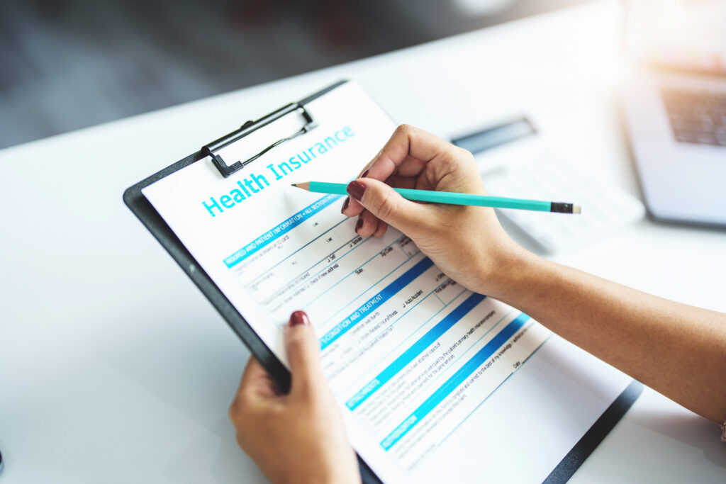 agreement, customer holding a pen to read health insurance requirements before signing contract documents.,https://www.bhgrecovery.com/wp-content/uploads/2026/01/insurance-claim-contract-agreement-customer-holding-a-pen-to-read-health-insurance-requirements-before-signing-contract-documents-1-scaled.jpeg,Person reviewing health insurance document with pen, highlighting coverage requirements and policy details.