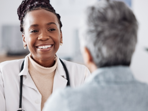 Healthcare provider and patient discussing Suboxone vs methadone treatment options for opioid use disorder in a clinical setting.