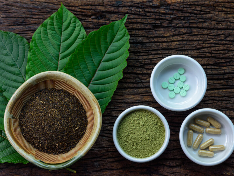 Various kratom products including dried leaves, powder and capsules, highlighting growing awareness of kratom ban regulations