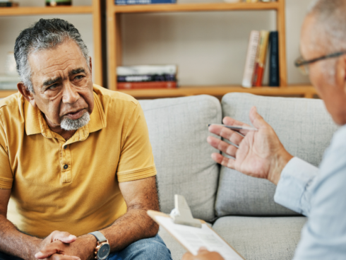 Person in a recovery meeting with a counselor to address co-occurring mental health and substance use disorders.