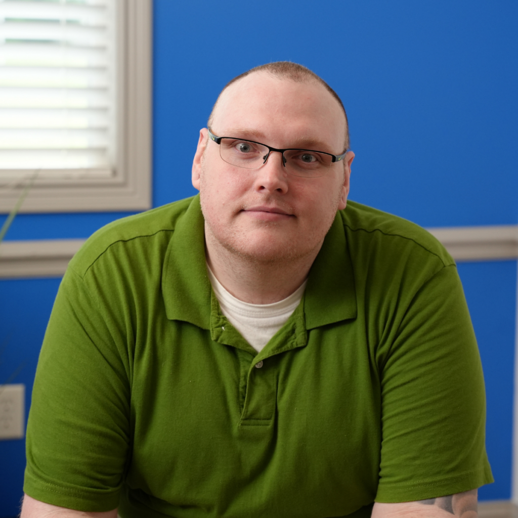 Photo of BHG patient Casey looking at the camera as he shares his recovery story from opioid use disorder.