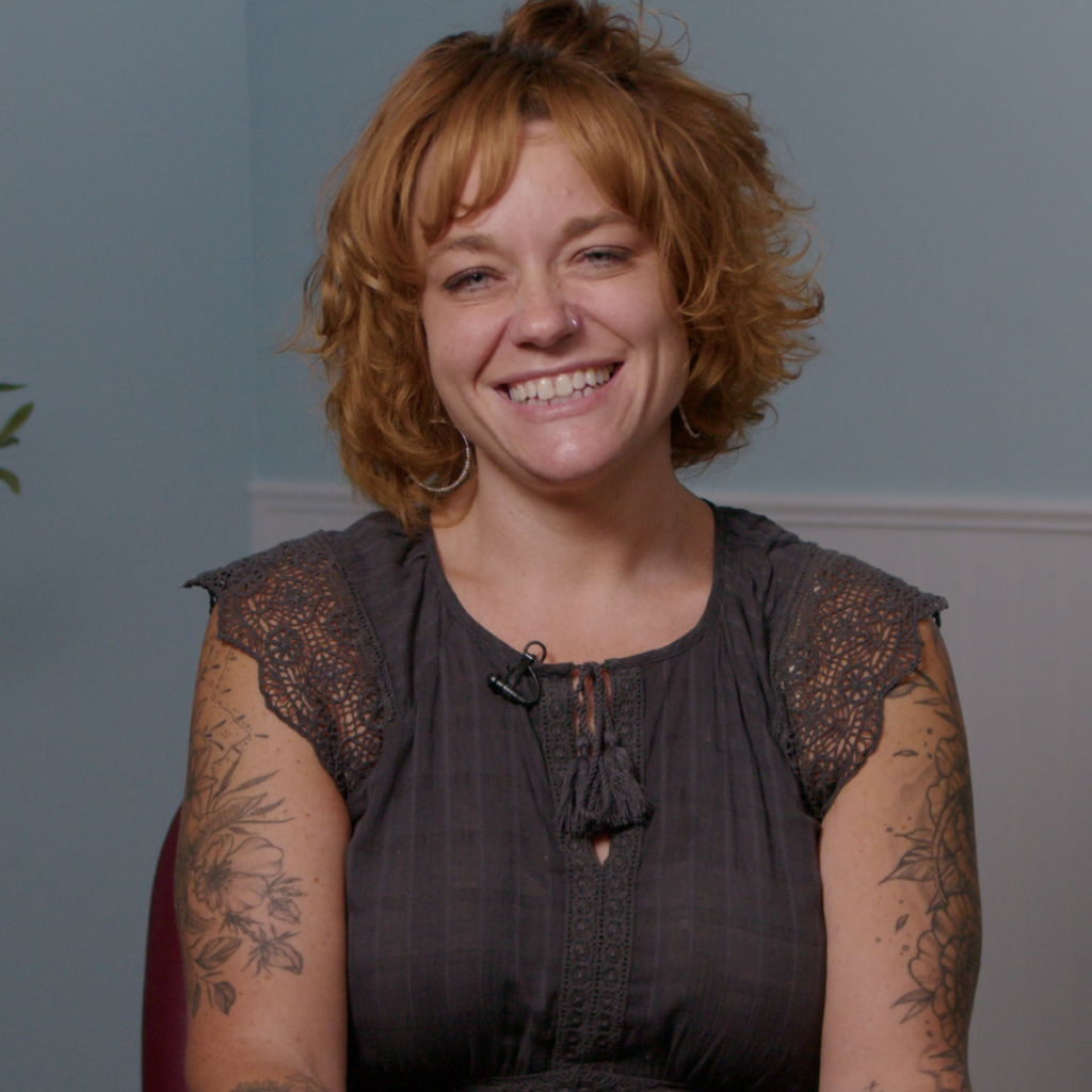 Photo of former Market Director Nicole Ross smiling at the camera as she shares her recovery story.