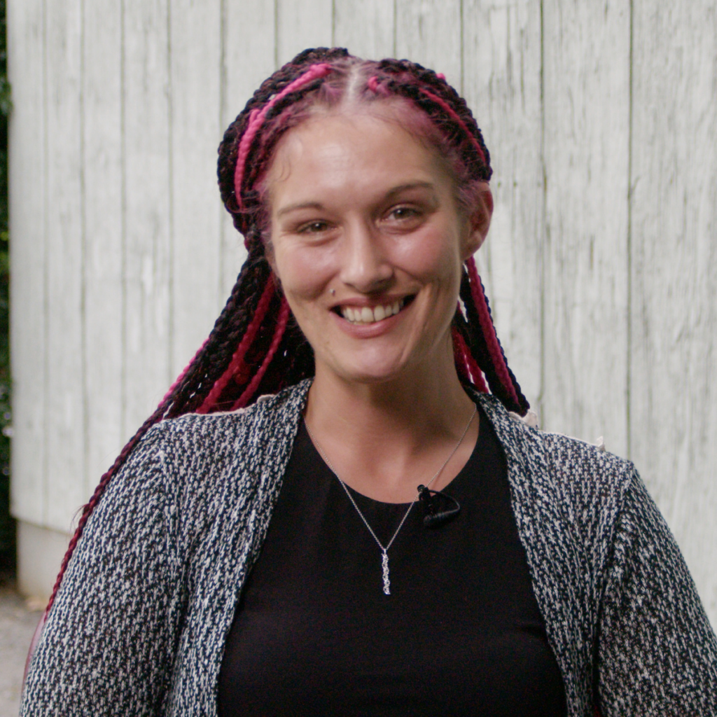 Photo of BHG patient Tatum looking at the camera as she shares her recovery story from opioid use disorder.