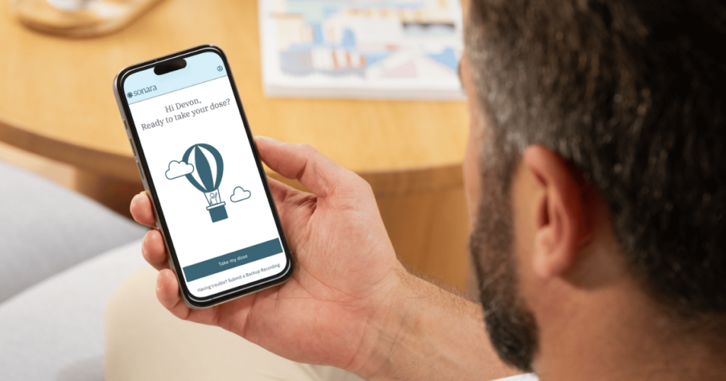 A patient using Sonara Health on a smartphone to support virtual take-home methadone treatment.
