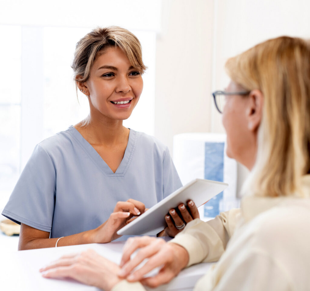 A healthcare professional discussing outpatient addiction treatment with a patient with opioid use disorder.