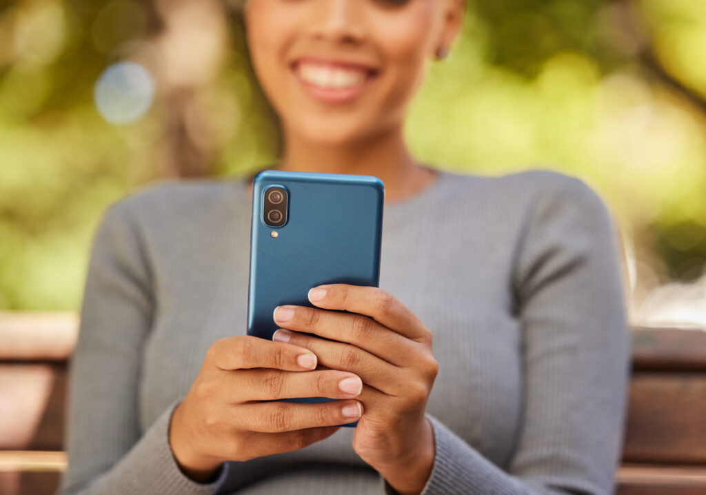 A patient using a smartphone for virtual take-home methadone dosing with Sonara Health.