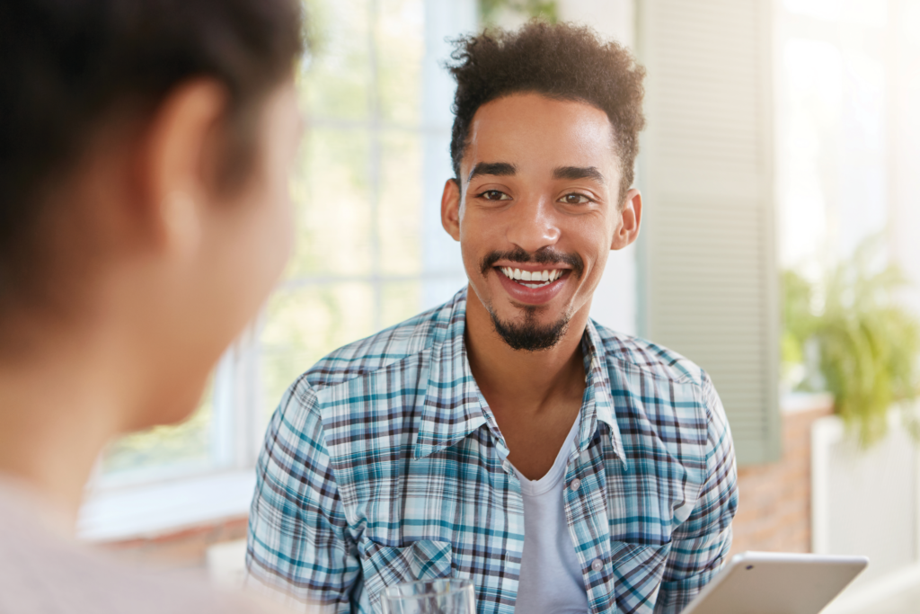 A patient speaking with a healthcare provider at a methadone and suboxone clinic about opioid use disorder treatment and recovery.